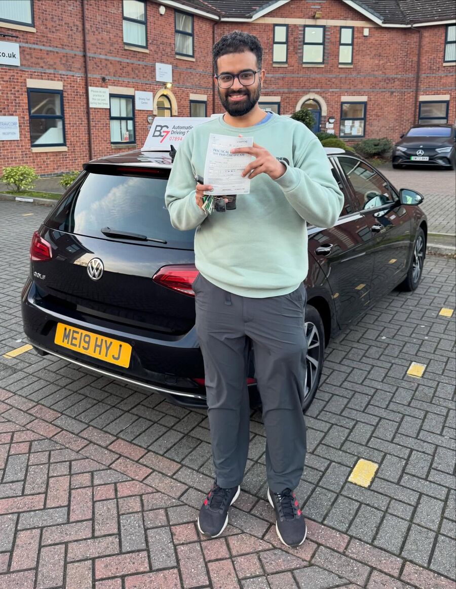 BG7 student celebrating passing their driving test, holding their pass certificate